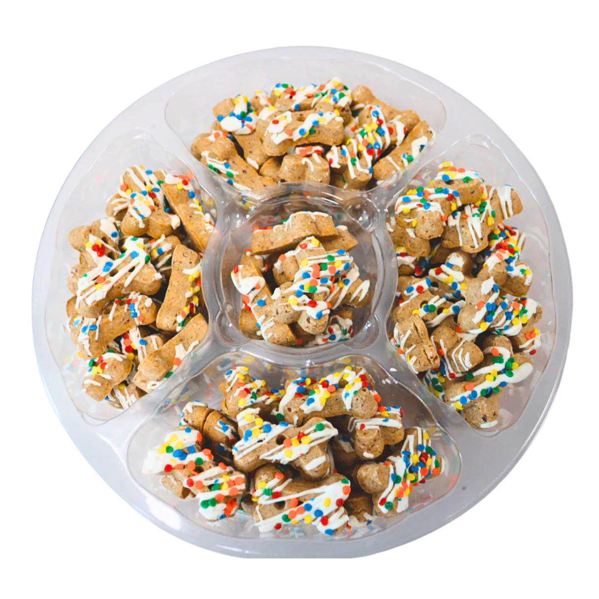 Dog treats with colorful sprinkles in a plastic tray on a white background
